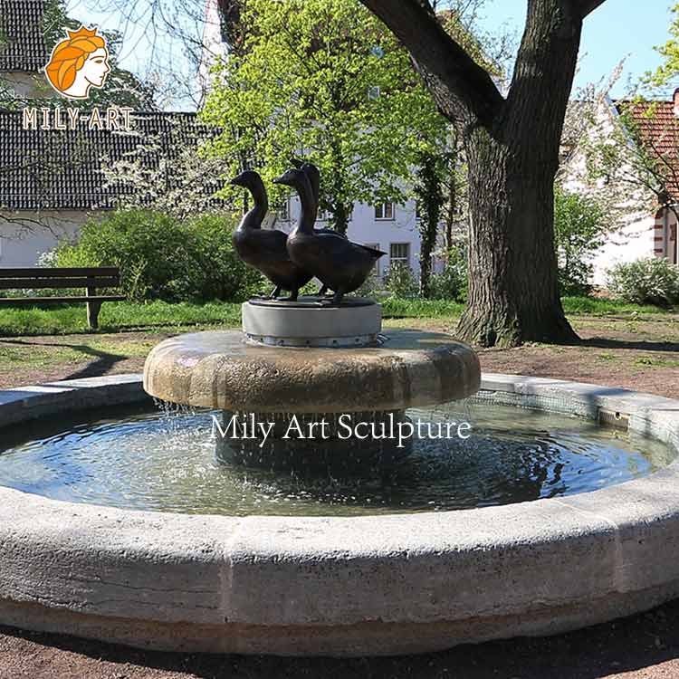 large outdoor fountain with lights