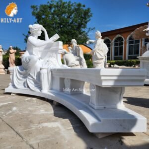 white marble garden bench with lady statue