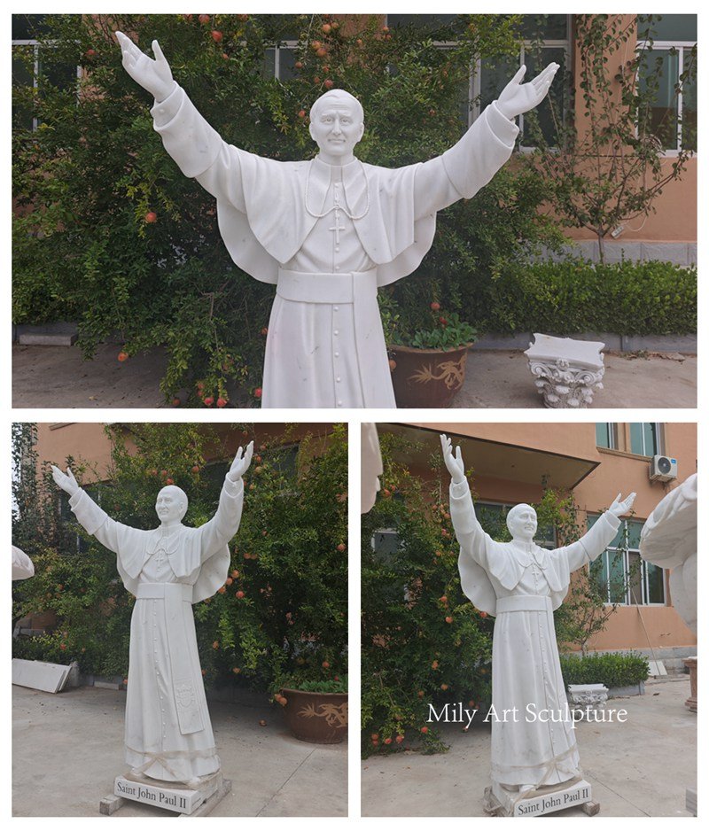 marble St John Paul II statue with opening arms